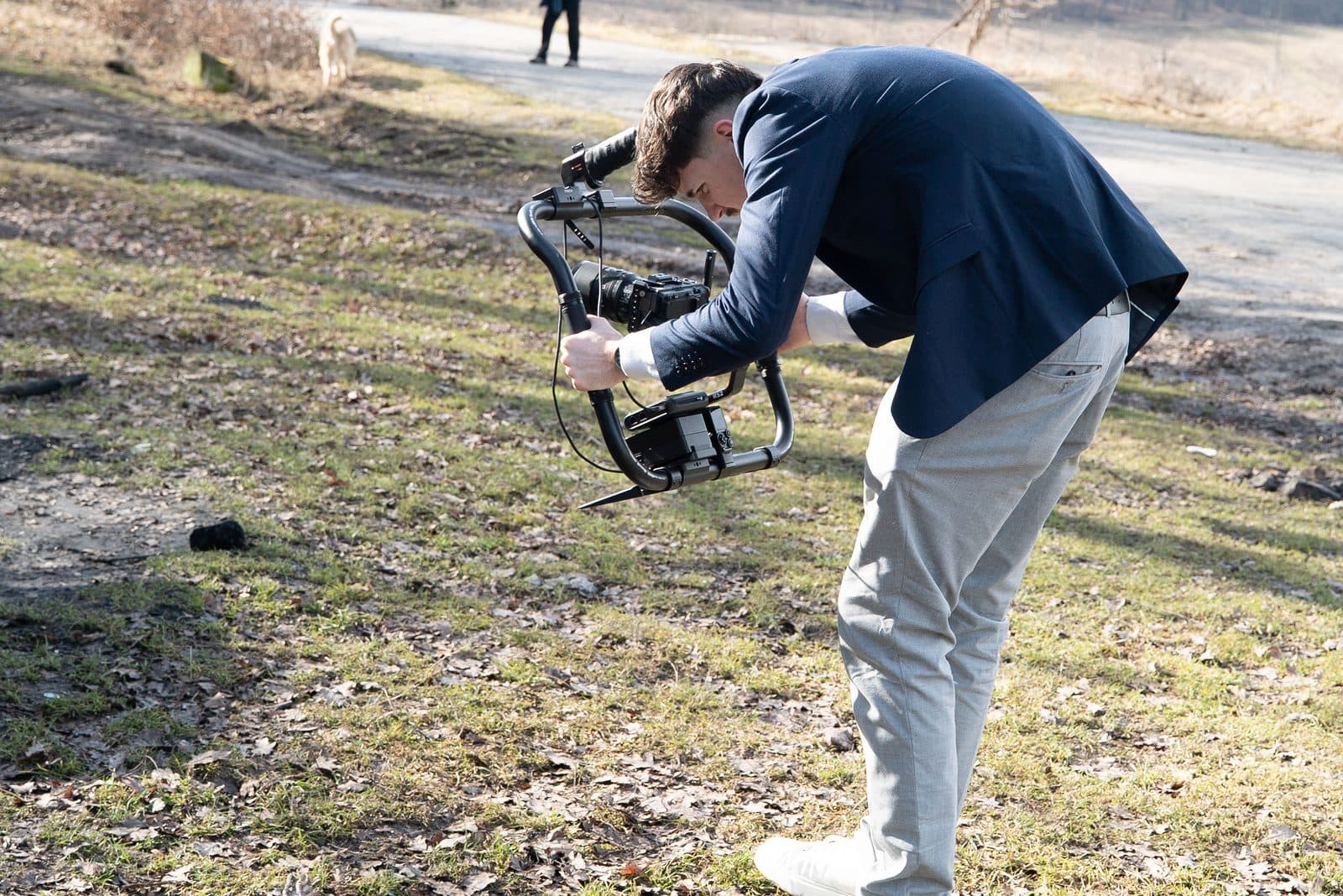 Halász Hunor framing a low-angle outdoor shot with a gimbal